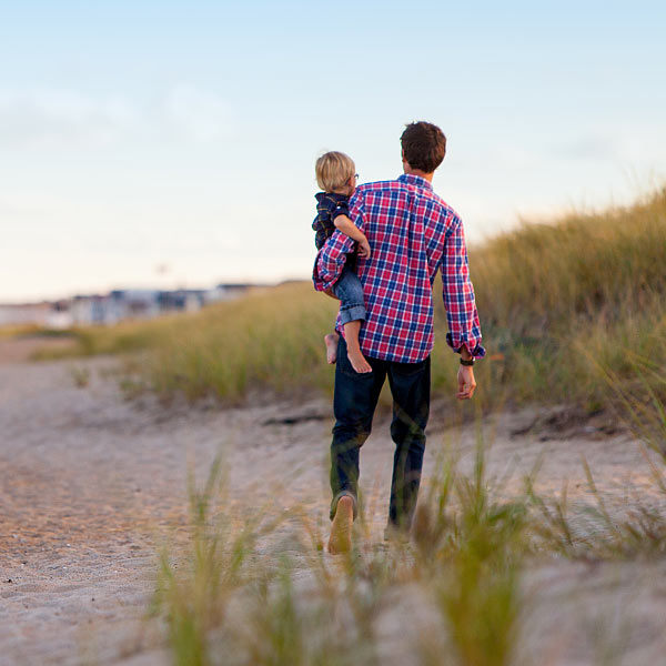 Father and Child Walking on the Beach Father and Child Walking on the Beach